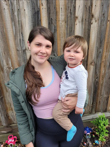 Parent and child enjoying outdoor time, highlighting the bond of nursing sports.