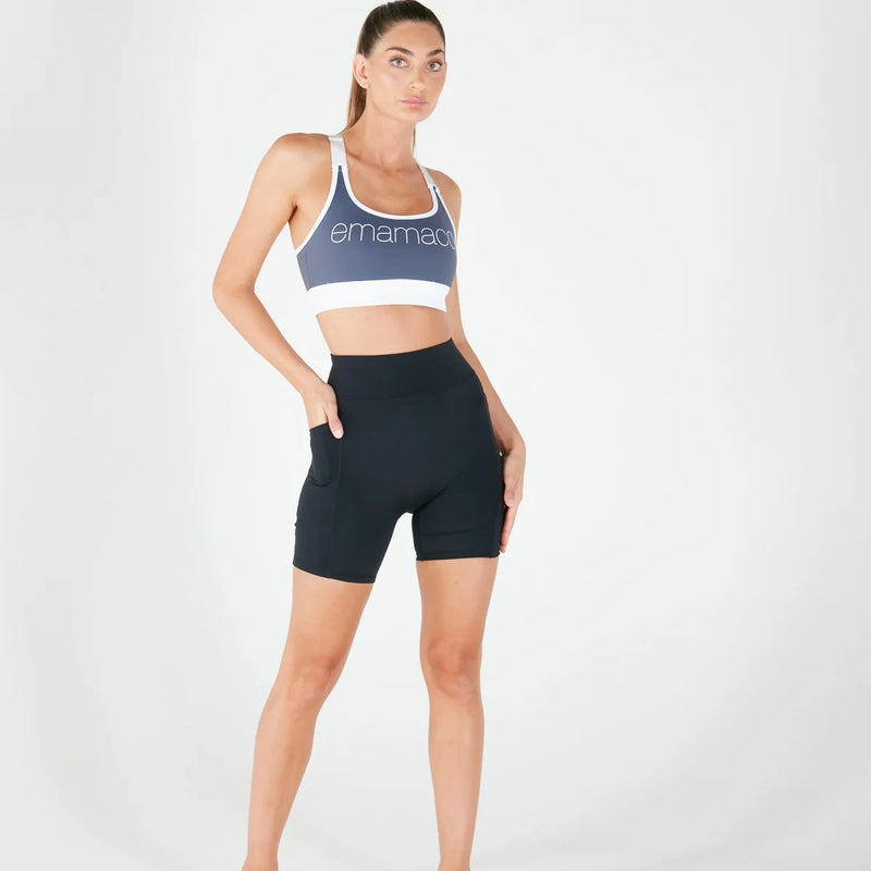 Woman in blue sports bra and black Vibe Shorts with regular fit waistband for everyday wear